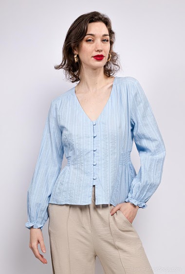 Long sleeve blouse, smocks. The model measures 177 cm