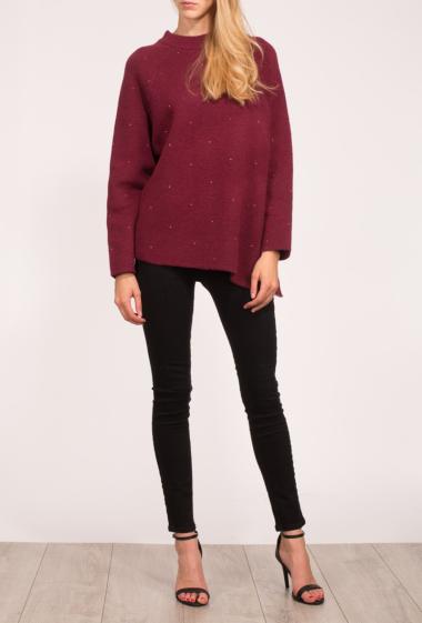 Pullover in knit decorated with strass, high collar, slit on the side