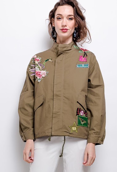 Parka with embroidered flowers. The model measures 177 cm