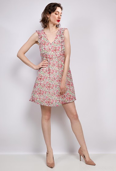 Flower print dress, ruffles, open back, knot. The model measures 177 cm