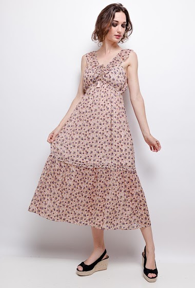 Dress with open back, printed flowers. The model measures 177cm