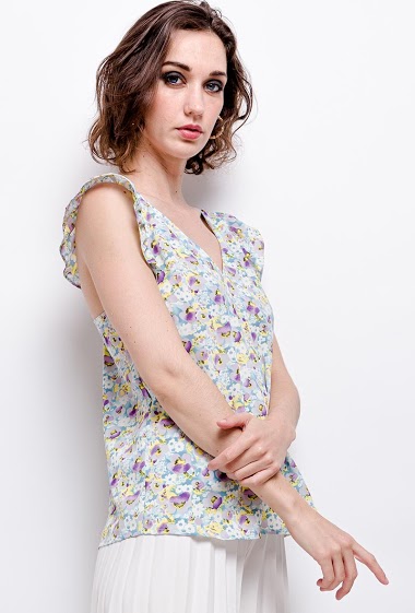 Tank top with ruffles, printed flowers. The model measures 177 cm