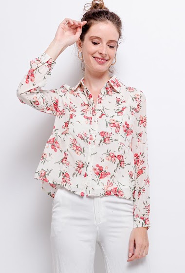 Blouse with printed flowers. The model measures 177 cm